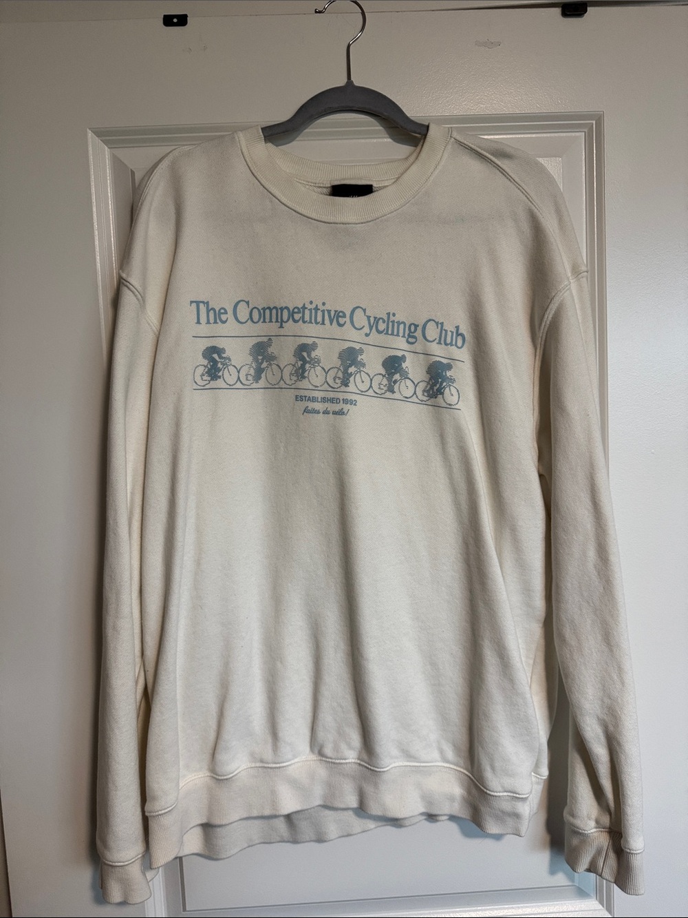 H&M Cream Crewneck Sweatshirt with Blue Cycling Graphic